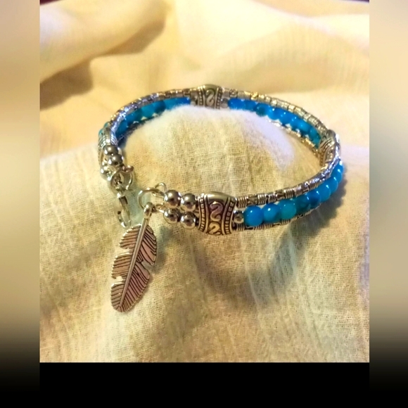 Silver and Blue Rice Bead Bracelet with Feather Charm - Picture 2 of 4